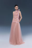 Pink Joséphine Bliss gown with elegant flowing fabric and draped design, perfect for formal occasions.