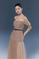 Beige ABIGAL gown by JOSÉPHINE, elegant women's dress featuring a flowing design and sophisticated style.