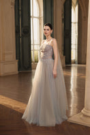 Elegant JOSÉPHINE MARTHA gown with flowing fabric and intricate detailing suitable for formal occasions.