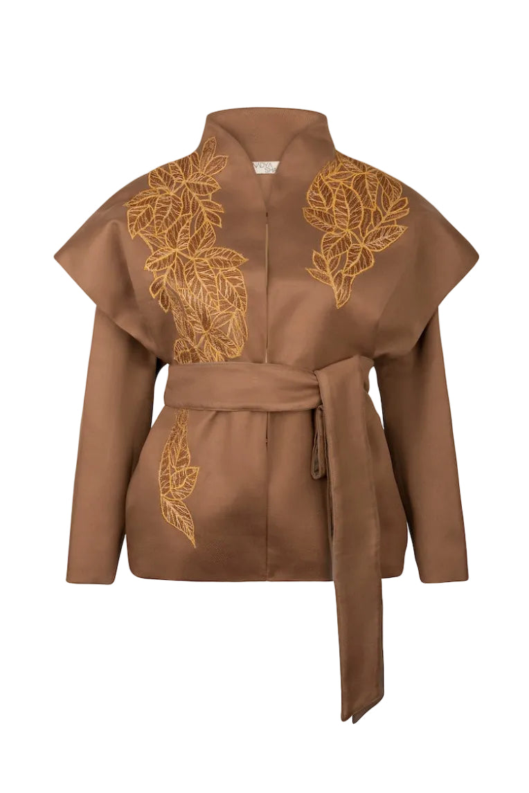 Ecru belted jacket by Nadya Shah featuring a relaxed fit and front view with a tie waist and stylish design.