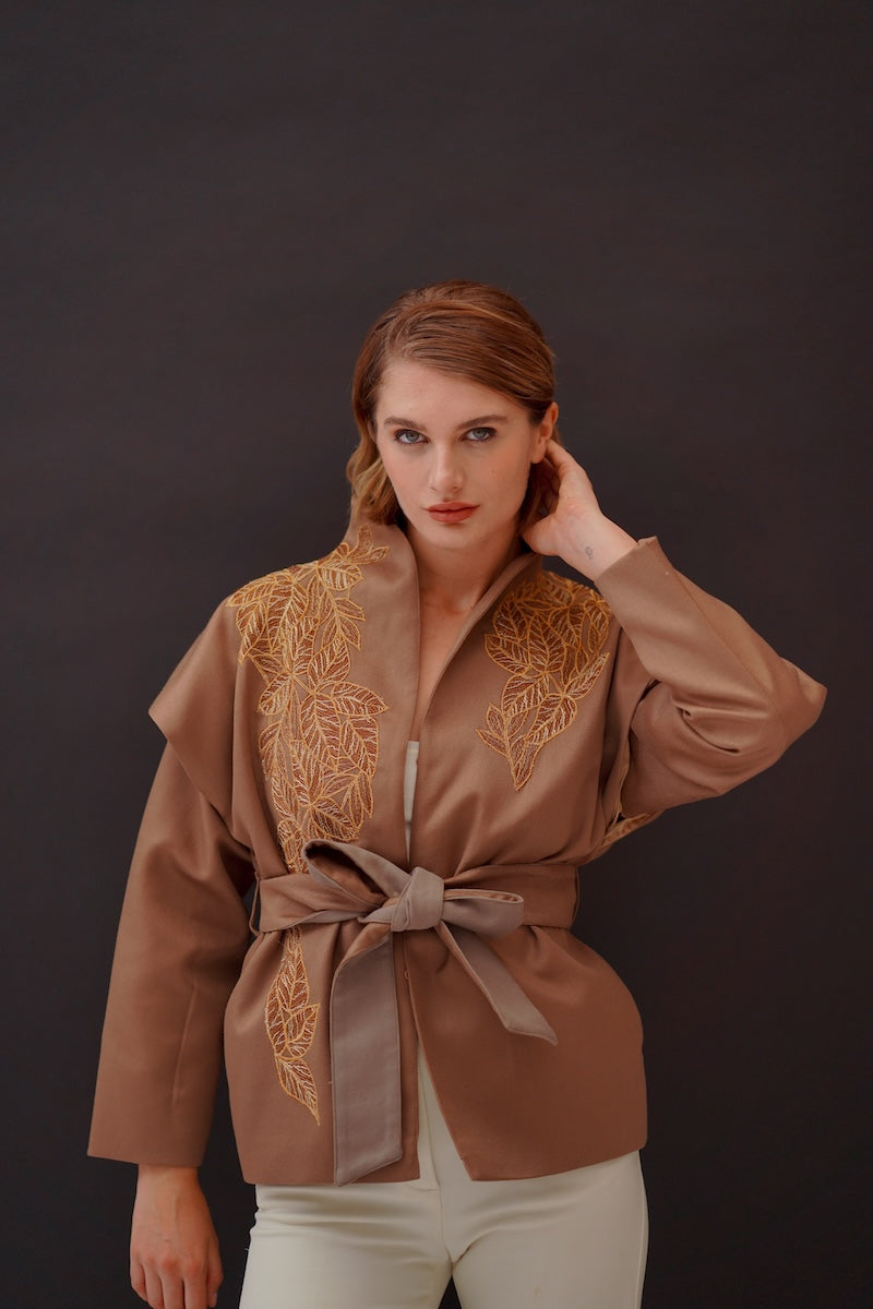 Nadya Shah Jules Ecru belted jacket featuring a stylish fit, shown in a neutral ecru color with a waist belt detail.