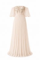 Elegant vanilla Juliette dress gown by Nihan Peker featuring flowing fabric and intricate detailing, displayed on a mannequin.