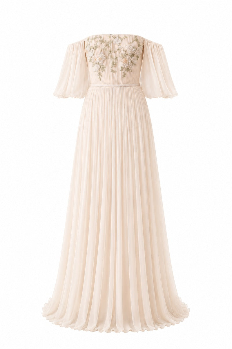 Elegant vanilla Juliette dress gown by Nihan Peker featuring flowing fabric and intricate detailing, displayed on a mannequin.