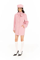 Nana Jacqueline Juliette cocoon pink coat displayed on a model with a relaxed fit and soft fabric, perfect for stylish winter wear.