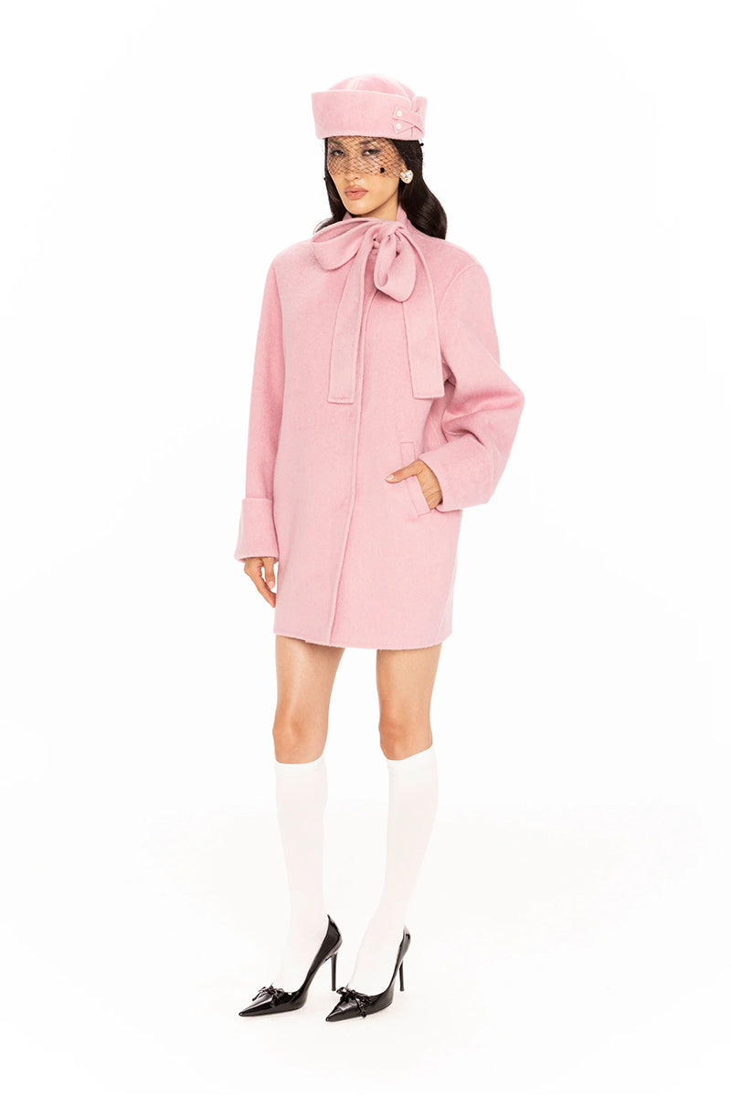 Nana Jacqueline Juliette cocoon pink coat displayed on a model with a relaxed fit and soft fabric, perfect for stylish winter wear.