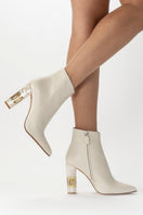 Elegant jasmine-colored boot heels by Freya Rose, featuring a sleek design and stylish heel, perfect for sophisticated footwear.