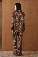 Women's silk pajama set featuring a jungle leopard print by MANITO, shown in a comfortable, stylish sleepwear design.