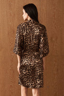 Women's silk robe by MANITO featuring a vibrant jungle leopard print, soft fabric, and relaxed fit for elegant comfort.