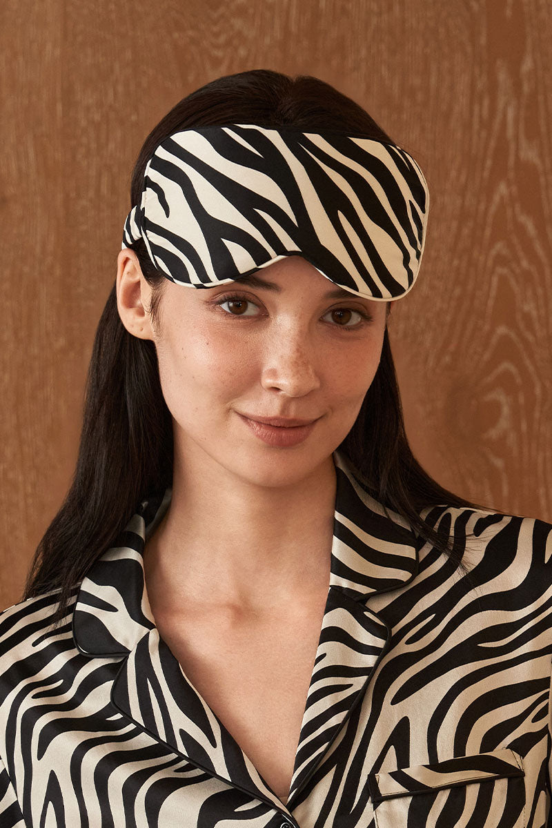 Silk eye mask with jungle zebra print by MANITO, featuring black and white zebra pattern for comfortable sleep.