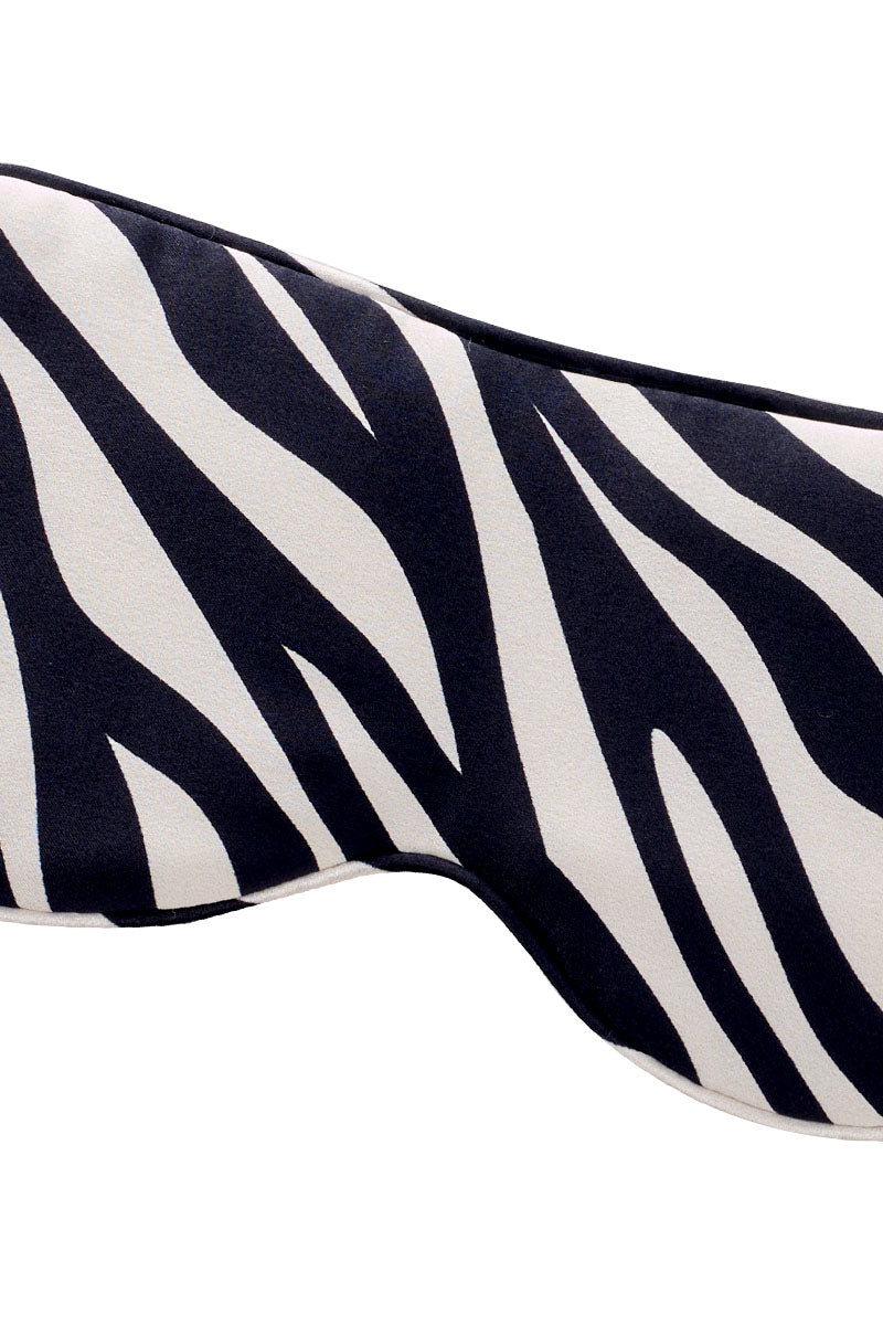 Silk eye mask with jungle zebra print by MANITO, featuring black and white zebra pattern for comfortable sleep or relaxation.