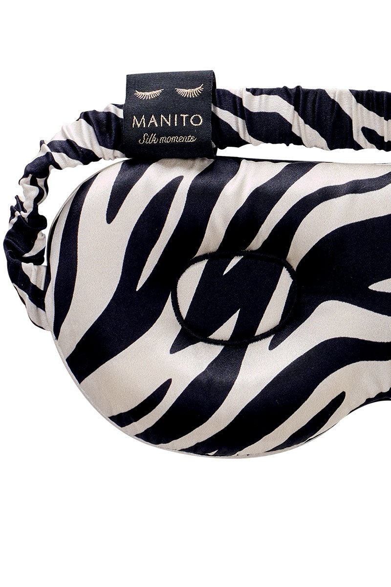 Manito jungle zebra print silk eye mask featuring black and white zebra pattern for restful sleep and relaxation.