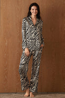 Women's silk pajama set with jungle zebra print by MANITO, featuring a relaxed fit and stylish zebra pattern.
