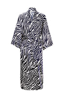Woman wearing a MANITO jungle zebra print silk robe, featuring a stylish zebra pattern and luxurious silky fabric.