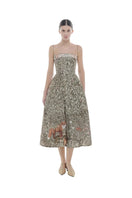 Montsand jungle printed gown with vibrant tropical leaf and animal pattern, flowing fabric, and elegant design.