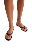 Black Kolane RIO sandal with open toe and strap design, featuring a comfortable flat sole for casual summer wear.
