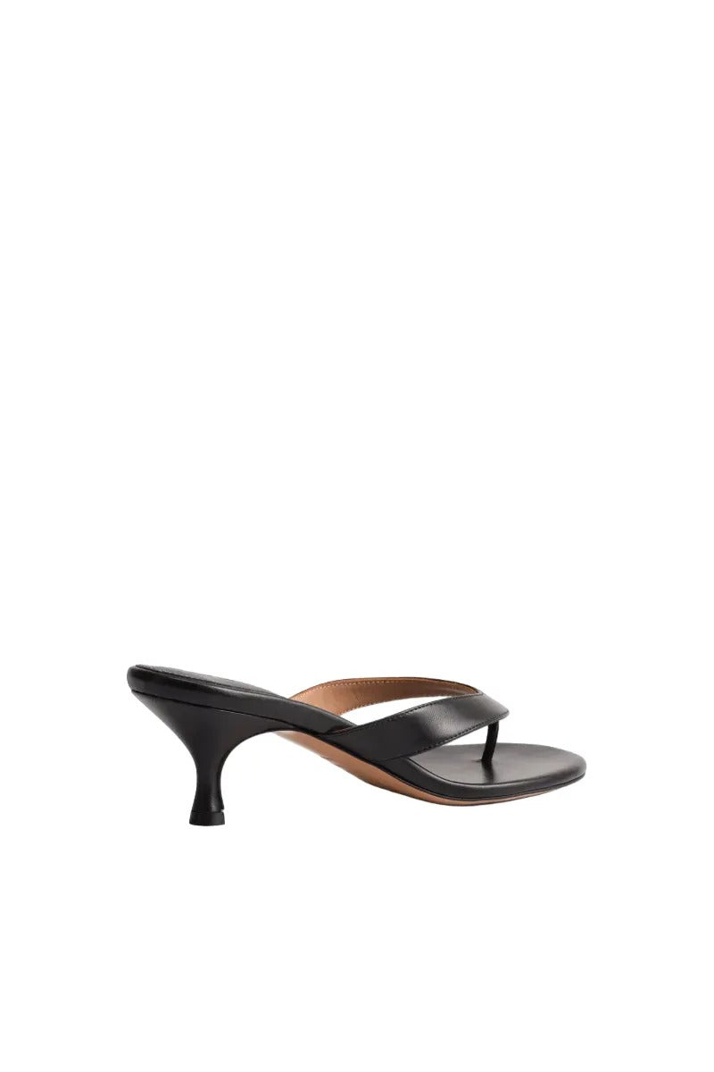 Black Kolane Annie sandal with a stylish design, featuring comfortable straps and a flat sole, perfect for casual wear.