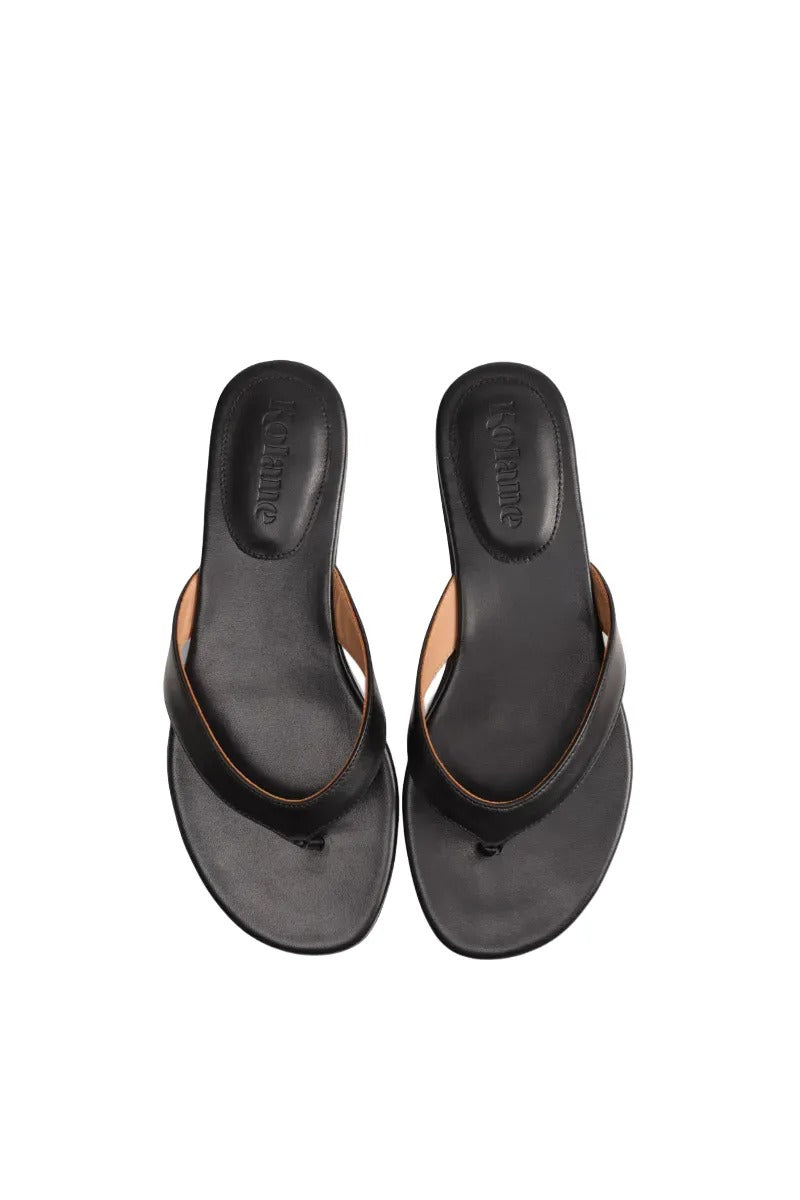 Black Kolane Rio sandals featuring sleek straps and a comfortable sole, perfect for casual summer wear.