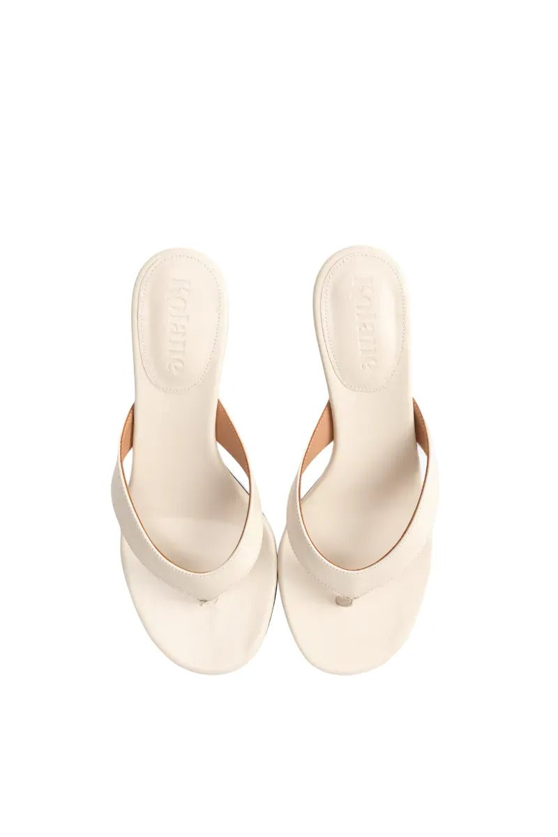 Kolane Annie Sandal 45 in ivory, stylish open-toe sandals with ankle straps, featuring elegant design and comfortable fit.