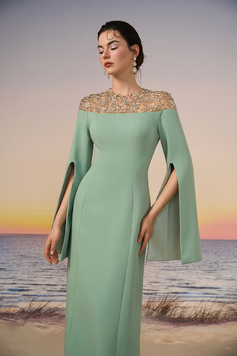 Mint green Calypso crepe gown by 21Six, featuring elegant design and flowing fabric, perfect for formal occasions.