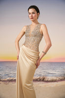 Beige silk satin and tulle gown by 21Six featuring elegant design with flowing fabric and intricate detailing.