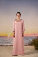 Light pink EIRA crepe gown by 21Six, elegant dress with flowing fabric and a sophisticated silhouette.
