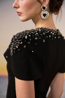 Black Serra Crepe Gown by 21Six, featuring elegant design and flowing fabric, perfect for formal occasions.
