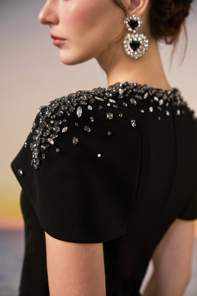 Black Serra Crepe Gown by 21Six, featuring elegant design and flowing fabric, perfect for formal occasions.