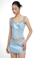 Light blue silk taffeta co-ord set with Delilah top and Marielle skirt by 21Six, shown on a model.