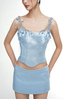 Light blue silk taffeta co-ords set featuring the Delilah top and Marielle skirt from 21Six, styled together.
