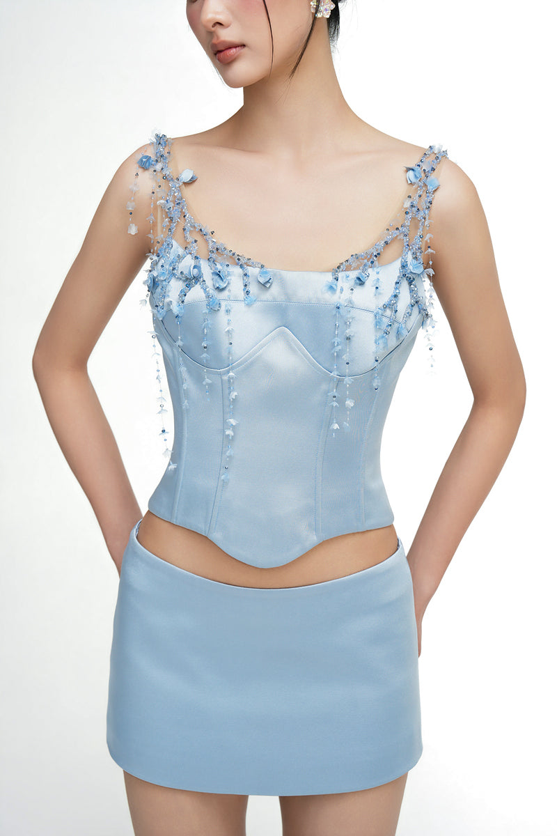 Light blue silk taffeta co-ords set featuring the Delilah top and Marielle skirt from 21Six, styled together.
