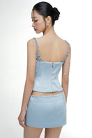 Light blue silk taffeta co-ords set with Delilah top and Marielle skirt by 21Six, shown on a model.