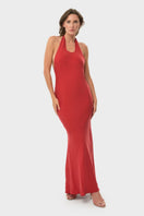 NiLuu CILLA slip dress in rouge, a stylish maxi dress with flowing fabric and elegant design, worn in a natural outdoor setting.