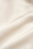 Creamy white VEZHA maxi skirt by PODYH, flowing fabric and elegant design, shown in this full-length image.