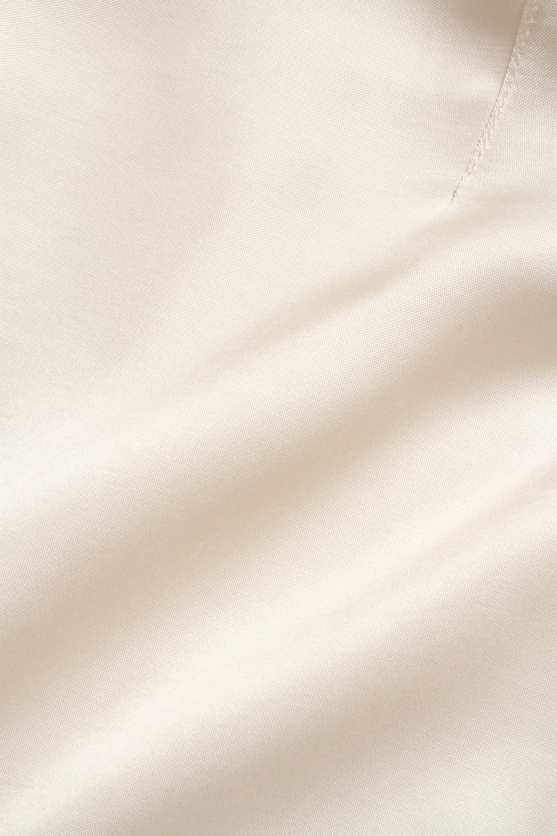 Creamy white VEZHA maxi skirt by PODYH, flowing fabric and elegant design, shown in this full-length image.
