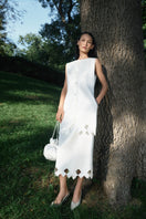 PODYH Tympan midi skirt in eggshell with a sleek, flowing design and subtle pleats, perfect for elegant everyday wear.