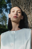 Podyh Tympan vest in eggshell color, lightweight vest with a smooth fabric finish, designed for casual and layered wear.