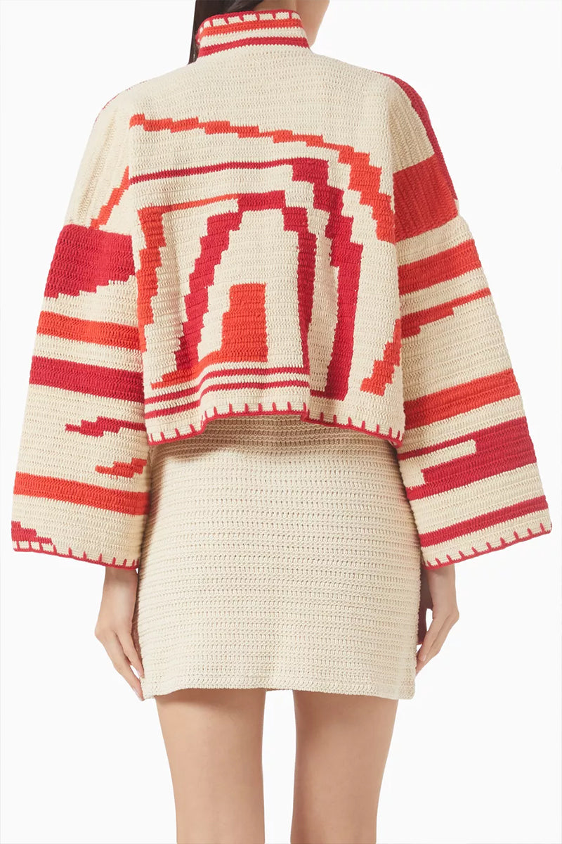 Jessica K Kiona cardigan in beige and red, featuring a cozy knit design with a button-up front and stylish relaxed fit.