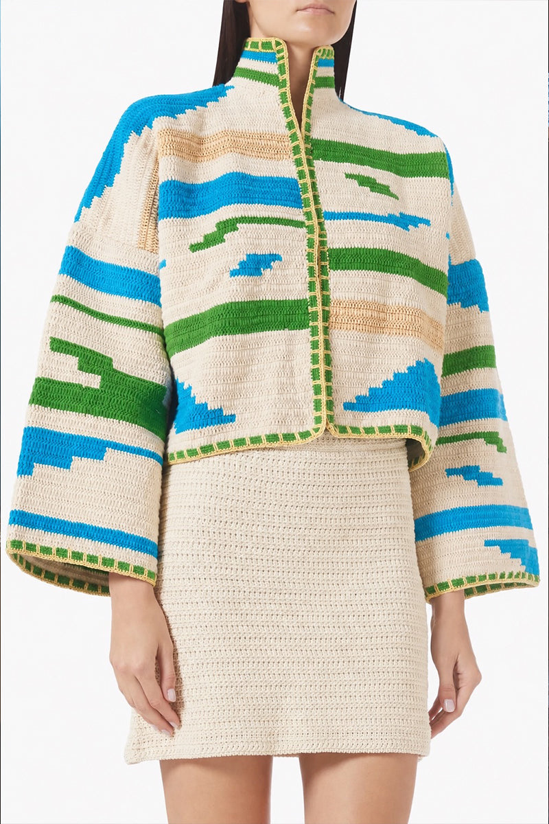 Jessica K Kiona cardigan in beige and green, featuring a cozy knit design with button details and a relaxed fit.