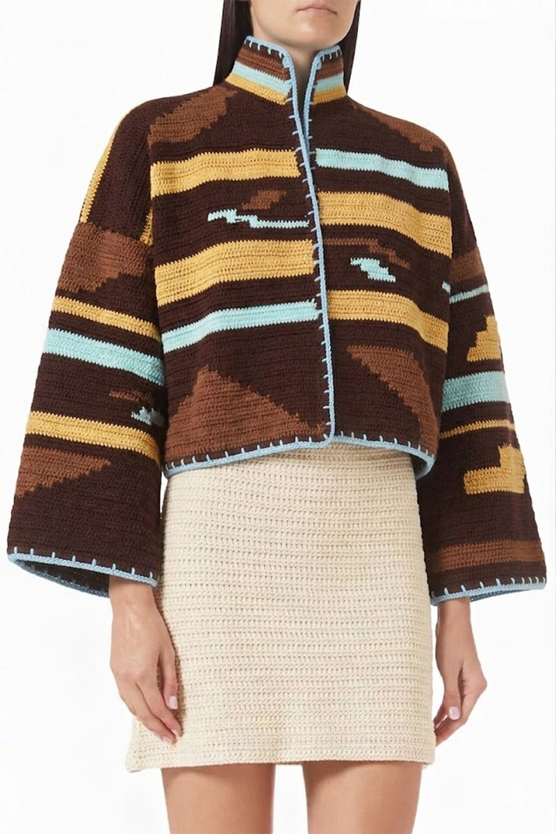Jessica K Kiona cardigan in brown and aqua, featuring a cozy knit design and button closure, displayed on a neutral background.
