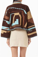 Jessica K Kiona cardigan in brown and aqua, featuring a cozy knit design and button details, displayed on a neutral background.