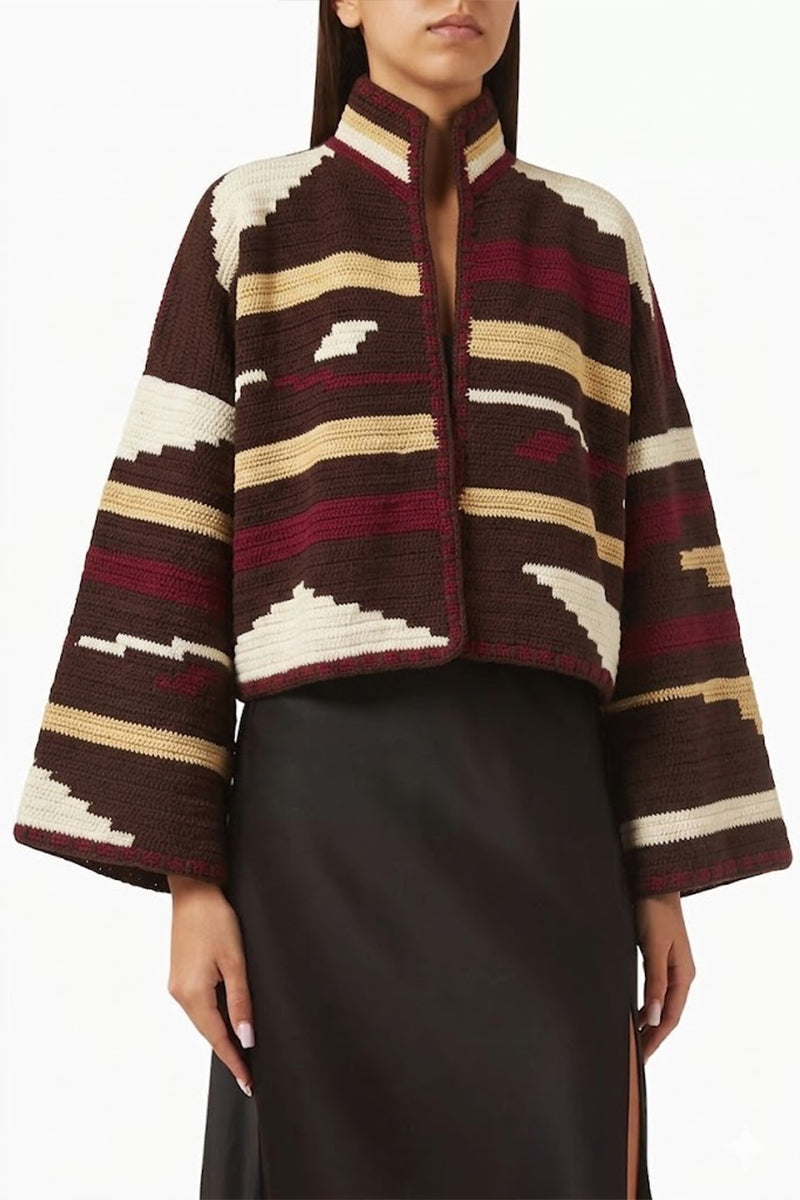 Jessica K Kiona cardigan in brown and burgundy, featuring a cozy knit design and relaxed fit, displayed on a hanger.