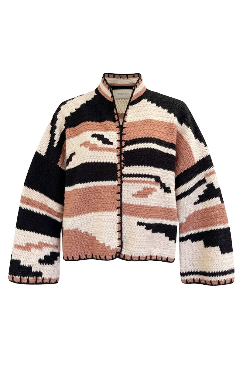 Jessica K Kiona cardigan in camel and black, soft knit fabric with a relaxed fit, displayed on a hanger.