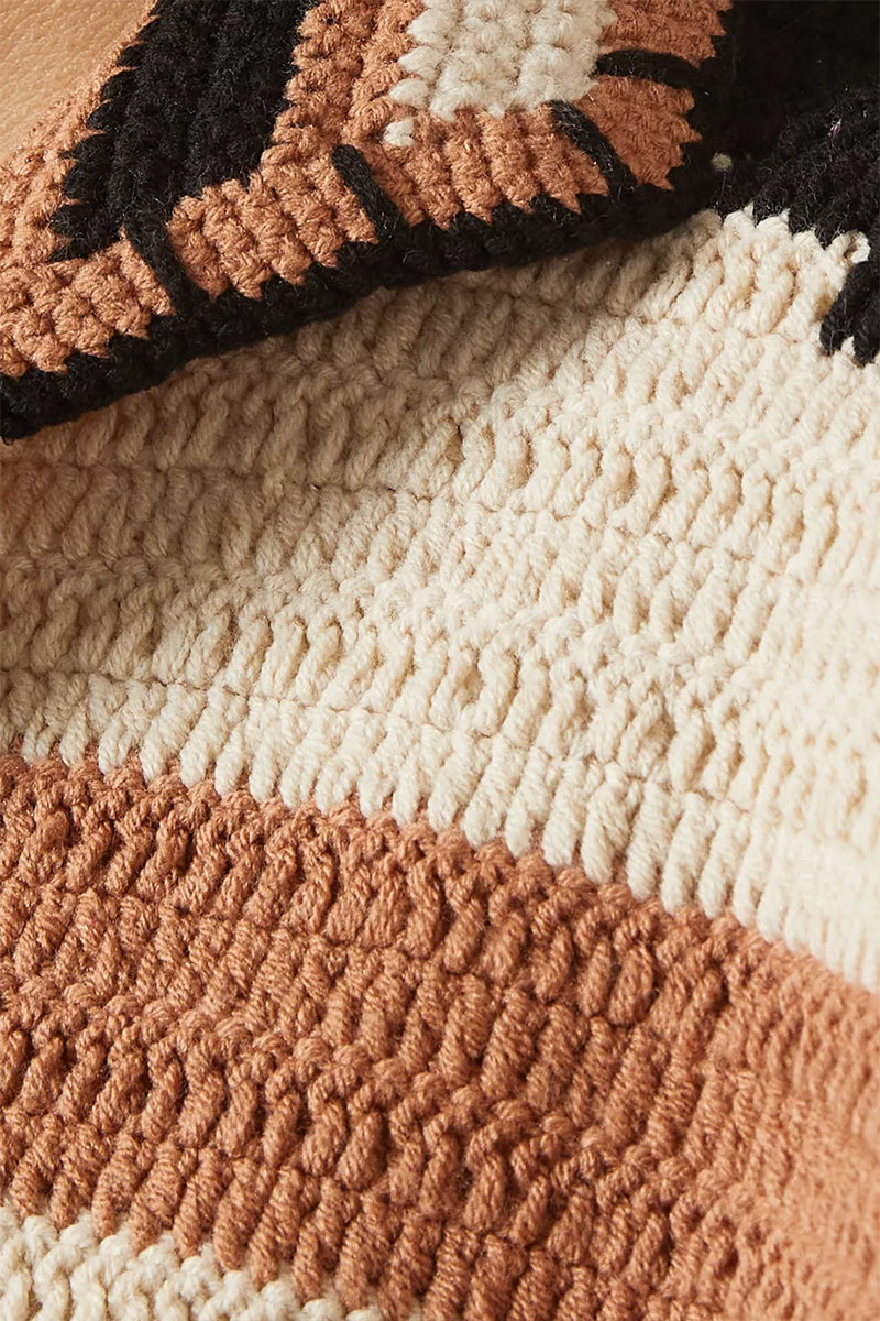 Jessica K Kiona cardigan in camel and black, displayed on a hanger with a close-up of the textured knit fabric.