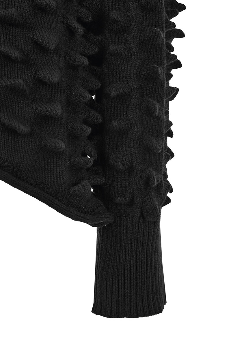 Cream knitted Peaks sweater by MAZ Manuela Álvarez featuring a cozy, textured knit pattern and a relaxed fit.