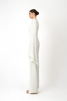 White KADELA top by Khanum's, featuring stylish fabric and a modern design, shown on a model.