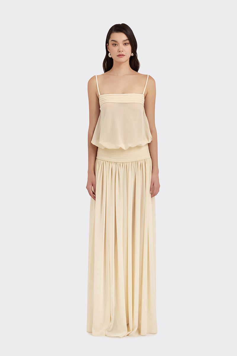 Beige satin maxi dress by Stolen Stores, featuring a flowing chiffon design and elegant length, perfect for formal occasions.