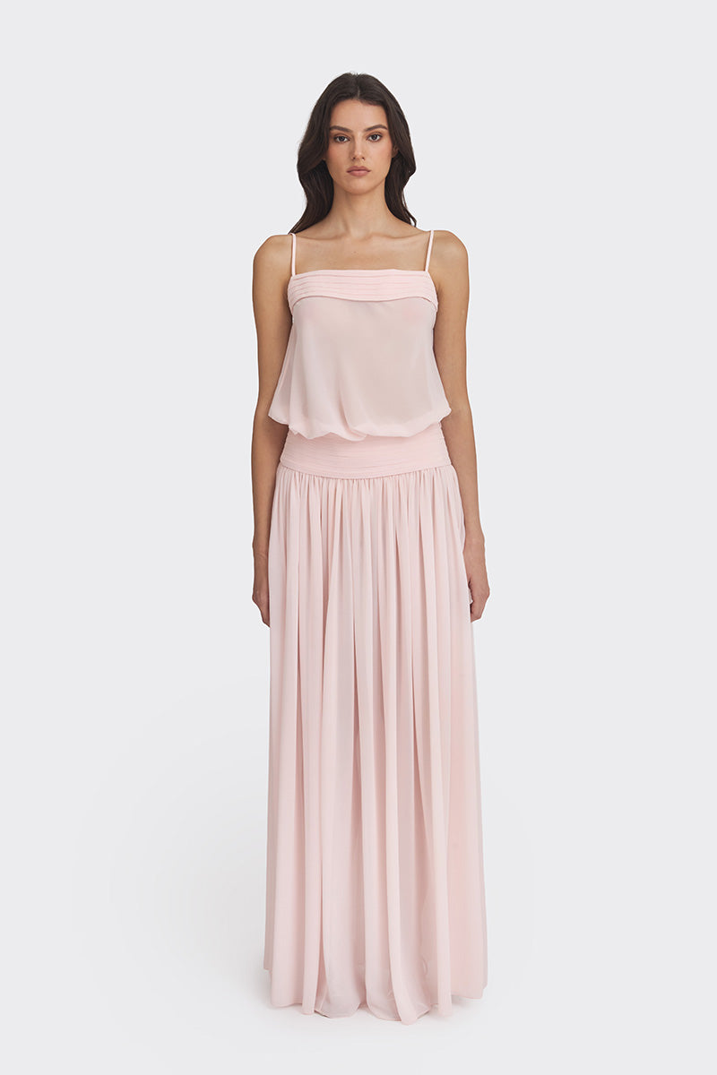 Light pink Stolen Stores Kaia chiffon maxi dress displayed on a hanger with flowing fabric and elegant design.