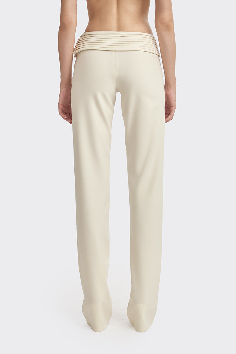 Stolen Stores Kaia pants in ivory white, featuring a relaxed fit and stylish design, displayed on a model.
