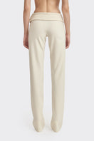 Stolen Stores Kaia pants in ivory white, featuring a relaxed fit and stylish design, displayed on a model.