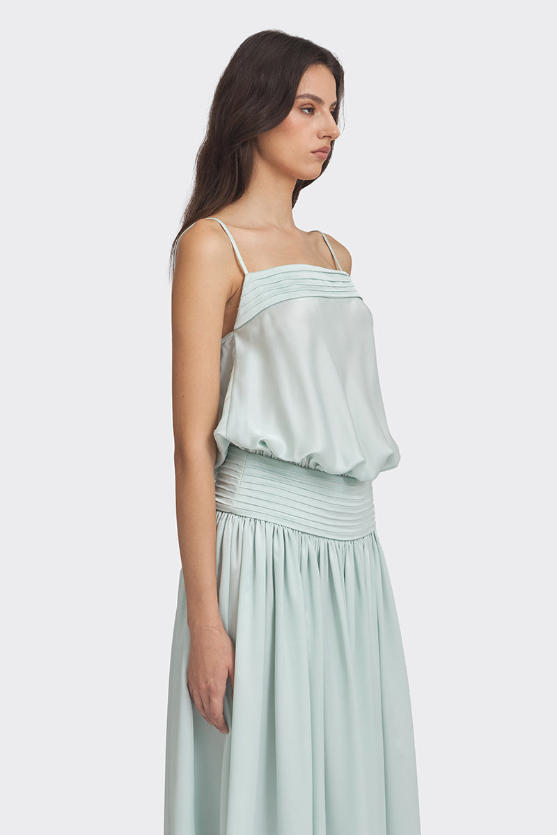 Light green satin maxi dress by Stolen Stores, flowing fabric and elegant design, shown on a model.